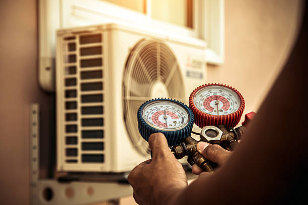Professional Air Conditioning Service technician working in Clayton, OH